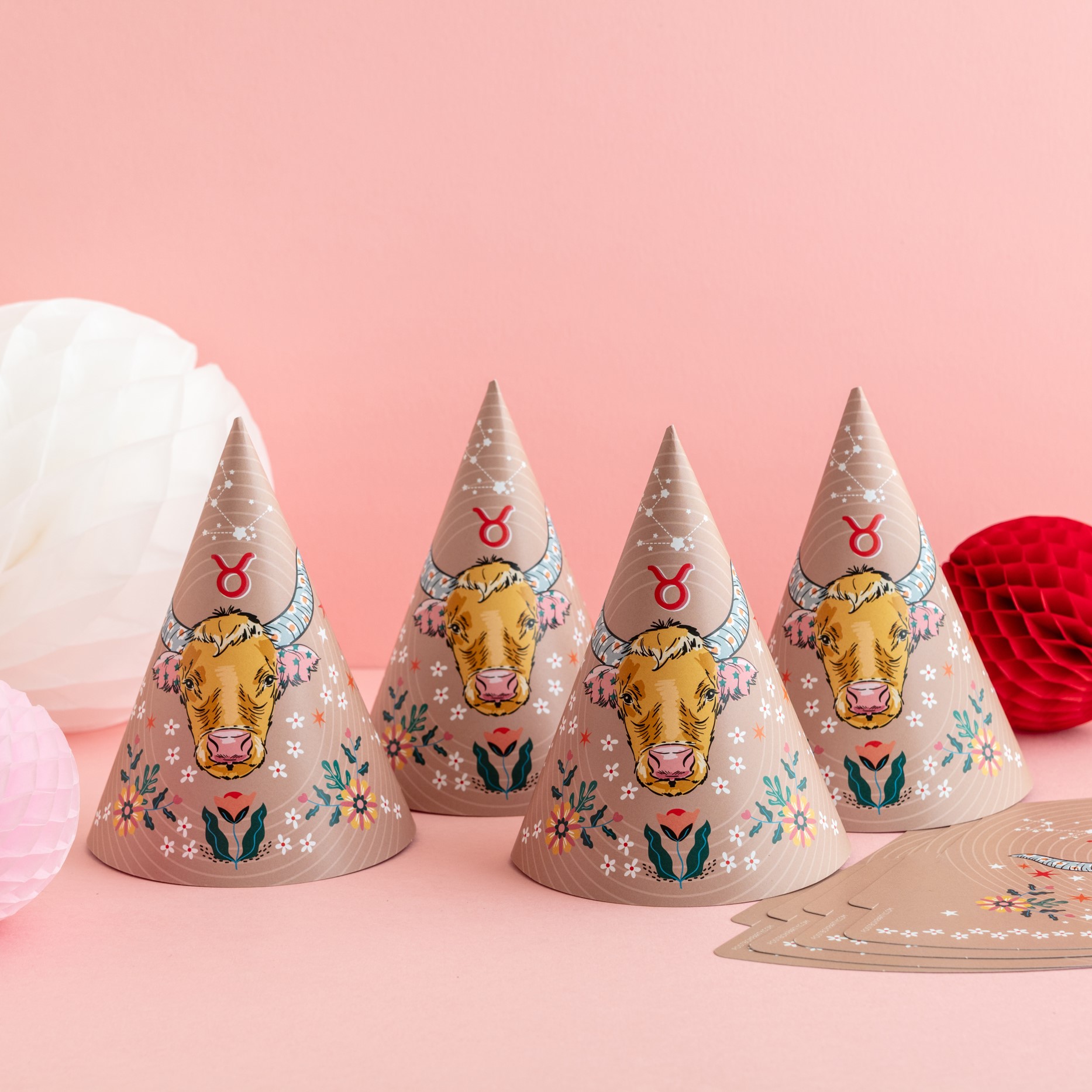 A multipack of colourful Taurus themed zodiac birthday party hats